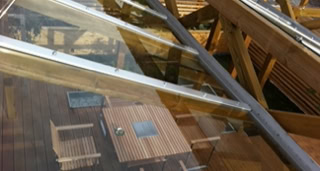 View of the wooden terrace from the transparent roof.