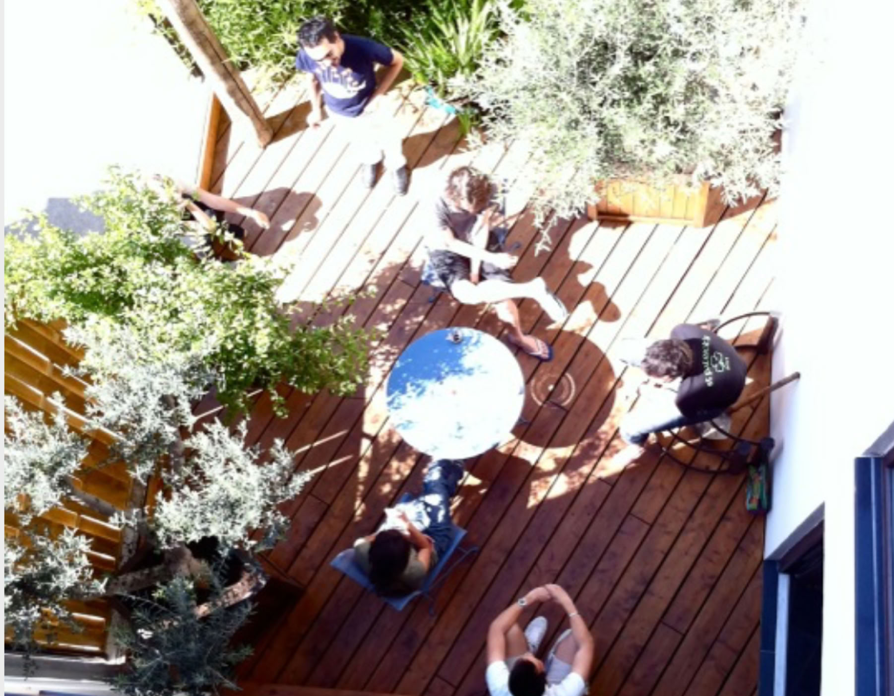Top view of a wooden terrace for a communal area in a project carried out by the agency.