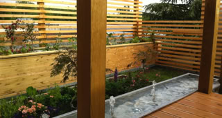 Planter and water basin on the wooden terrace.